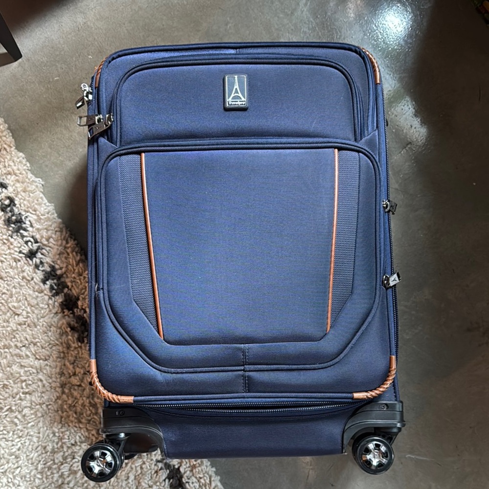Navy TravelPro Luggage with Durable Design and Multiple Compartments